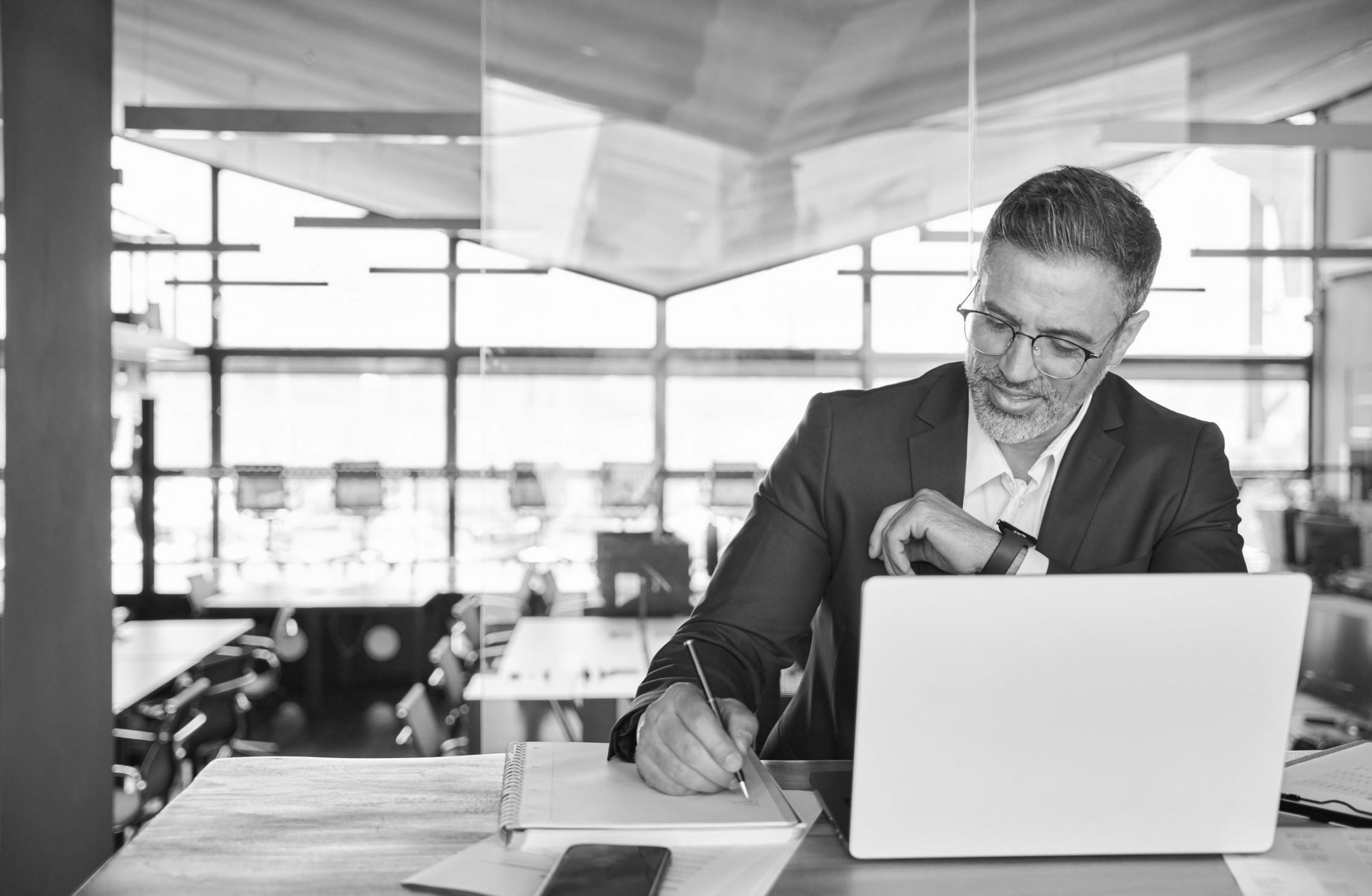 Student working through complex financial models with guidance